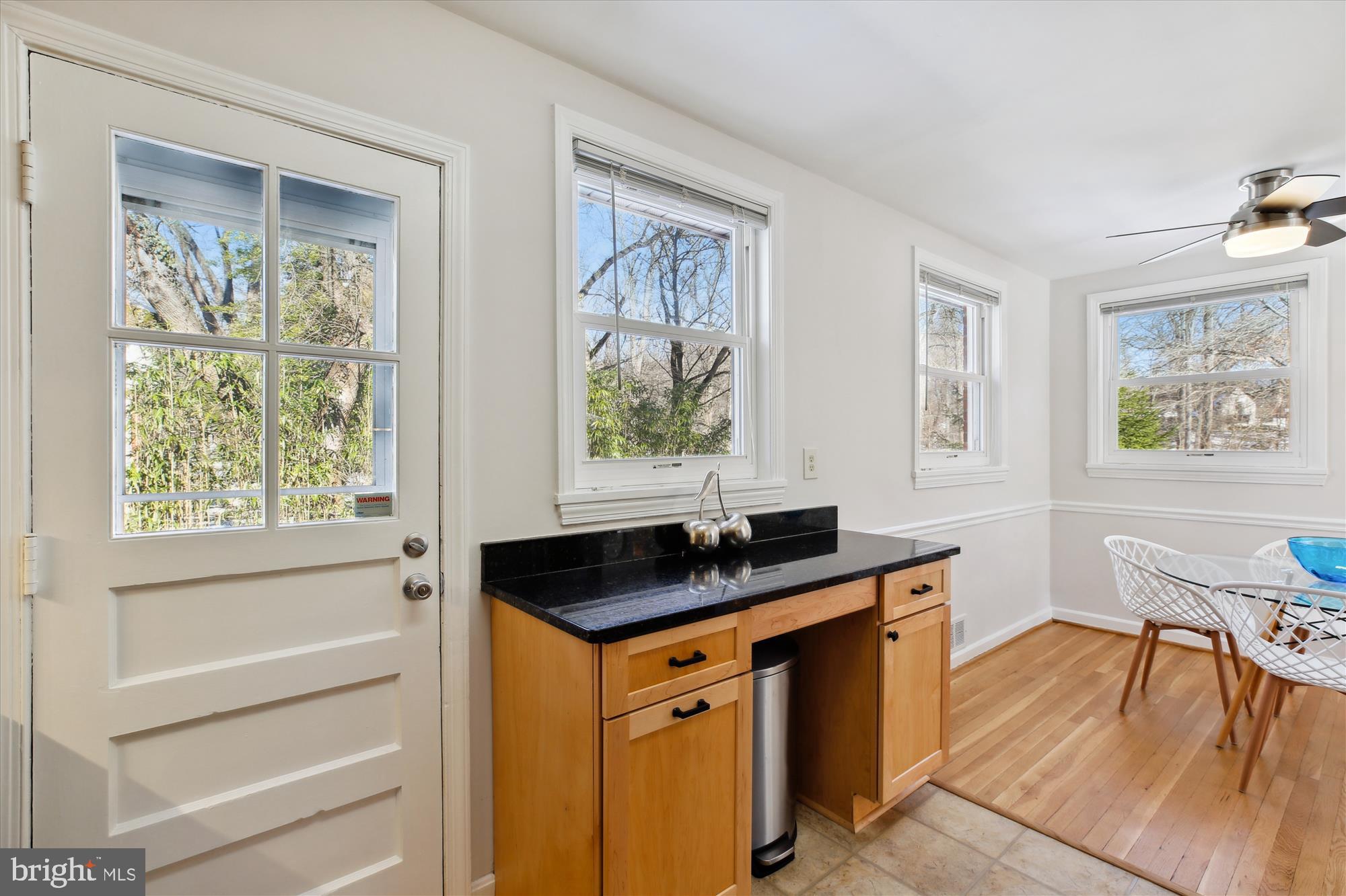 401 Greenbrier Drive Silver Spring, MD 20910 - Photo 20 of 57 a kitchen with stainless steel appliances granite countertop a stove a sink and a window