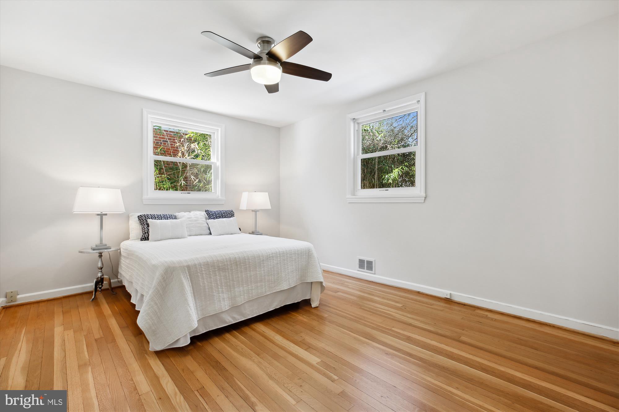 401 Greenbrier Drive Silver Spring, MD 20910 - Photo 21 of 57 a spacious bedroom with a bed and a window