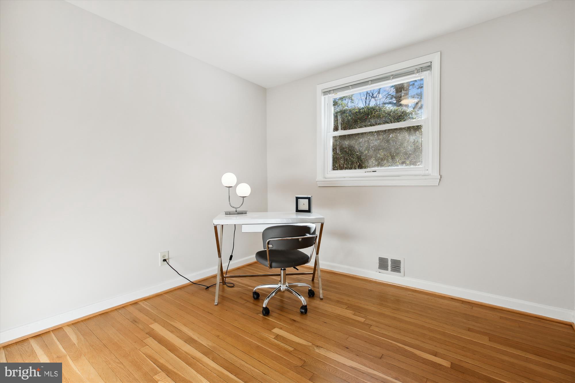 401 Greenbrier Drive Silver Spring, MD 20910 - Photo 27 of 57 a view of a workspace with furniture and a window