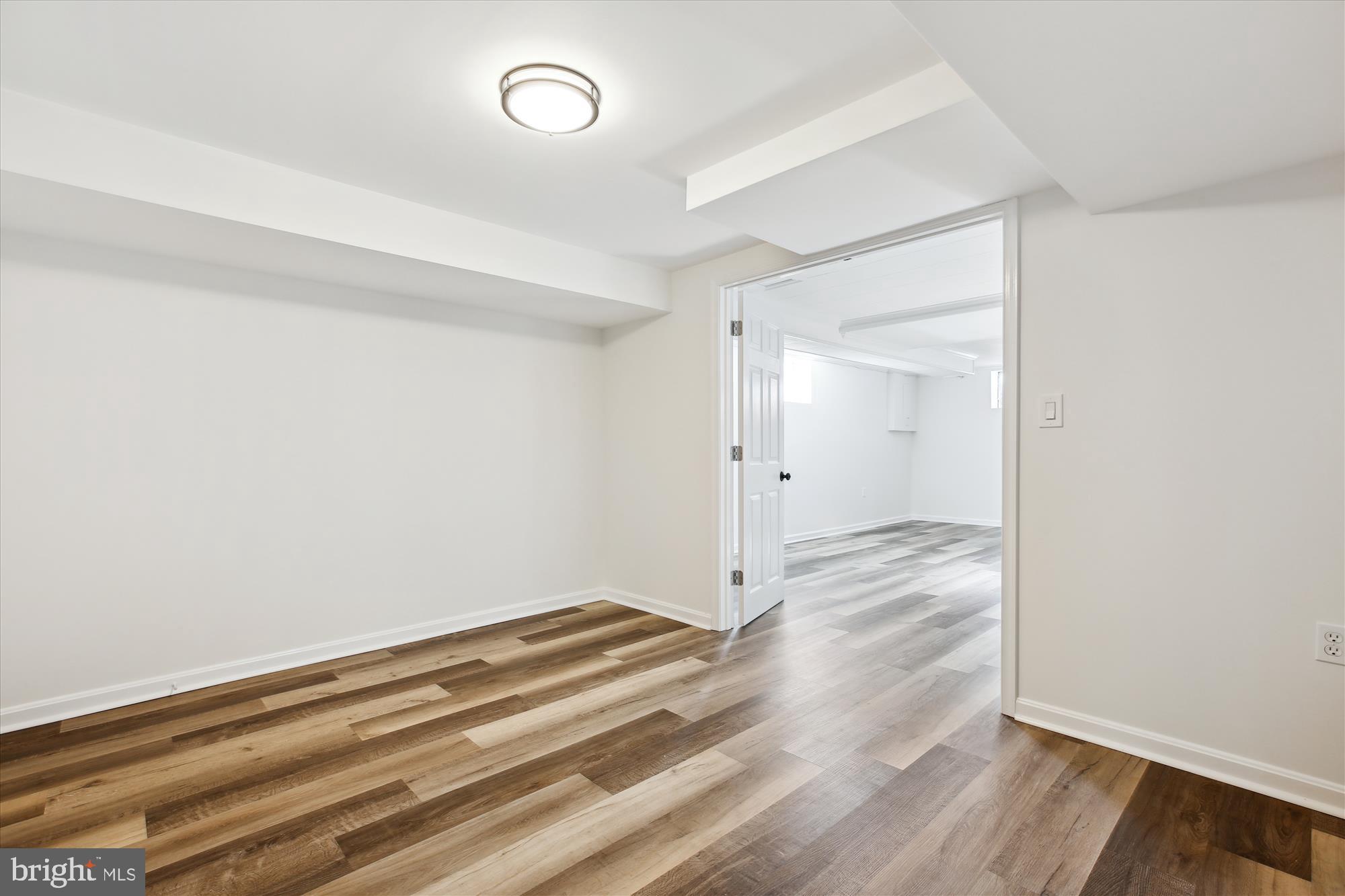 401 Greenbrier Drive Silver Spring, MD 20910 - Photo 39 of 57 a view of a room with wooden floor and white walls
