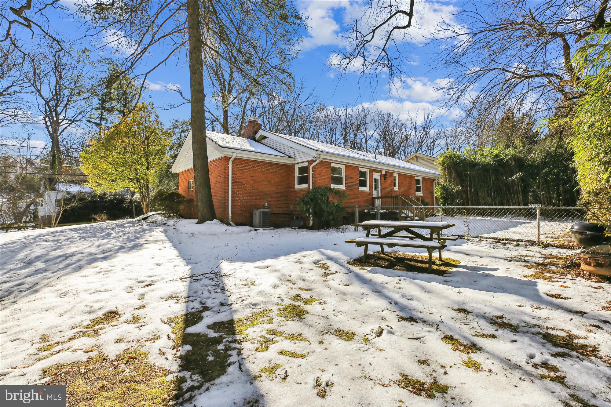 401 Greenbrier Drive Silver Spring, MD 20910 - Photo 47 of 57 a view of a house with a snow on the road