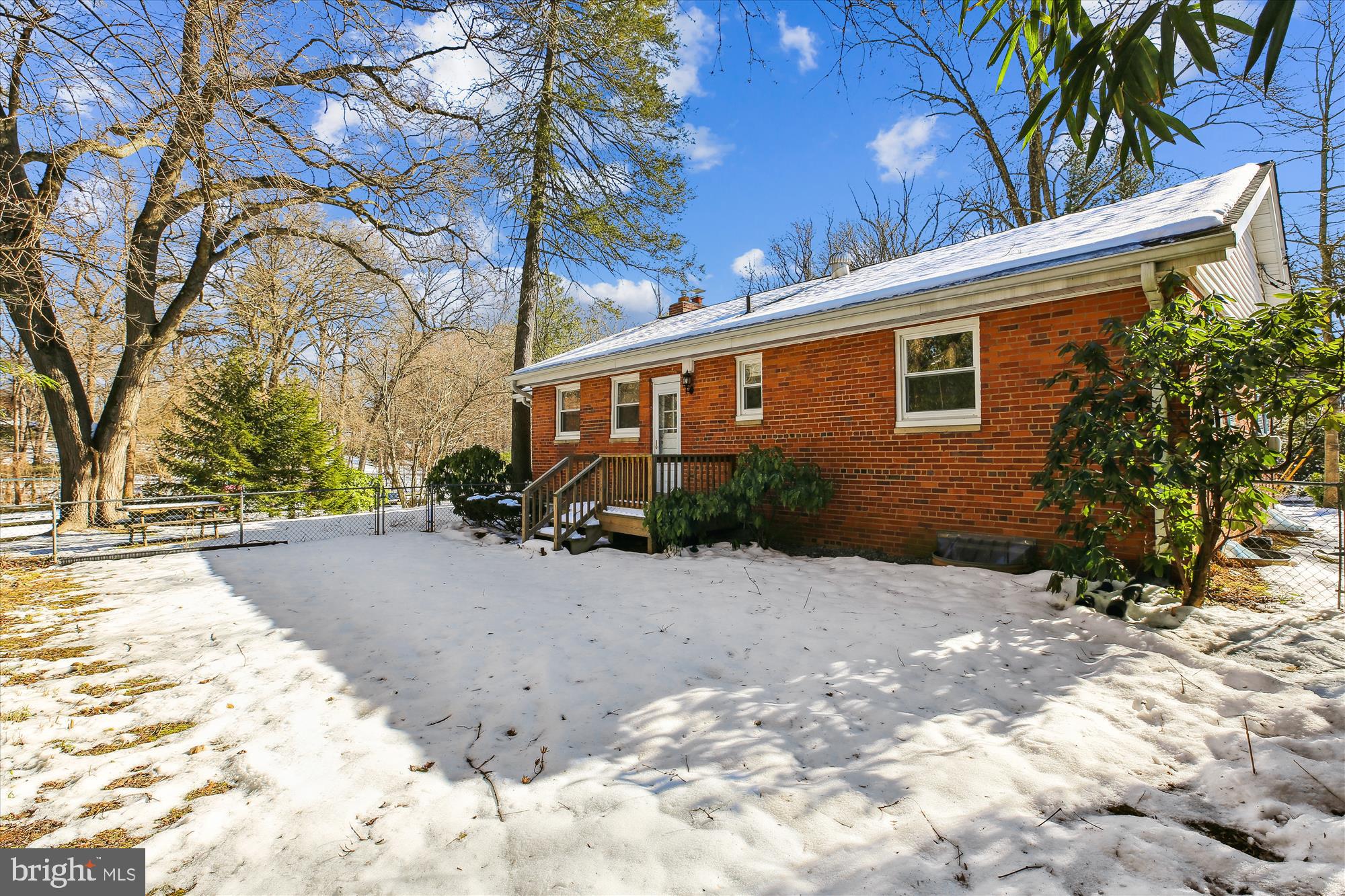 401 Greenbrier Drive Silver Spring, MD 20910 - Photo 48 of 57 a backyard of a house with wooden fence and large trees