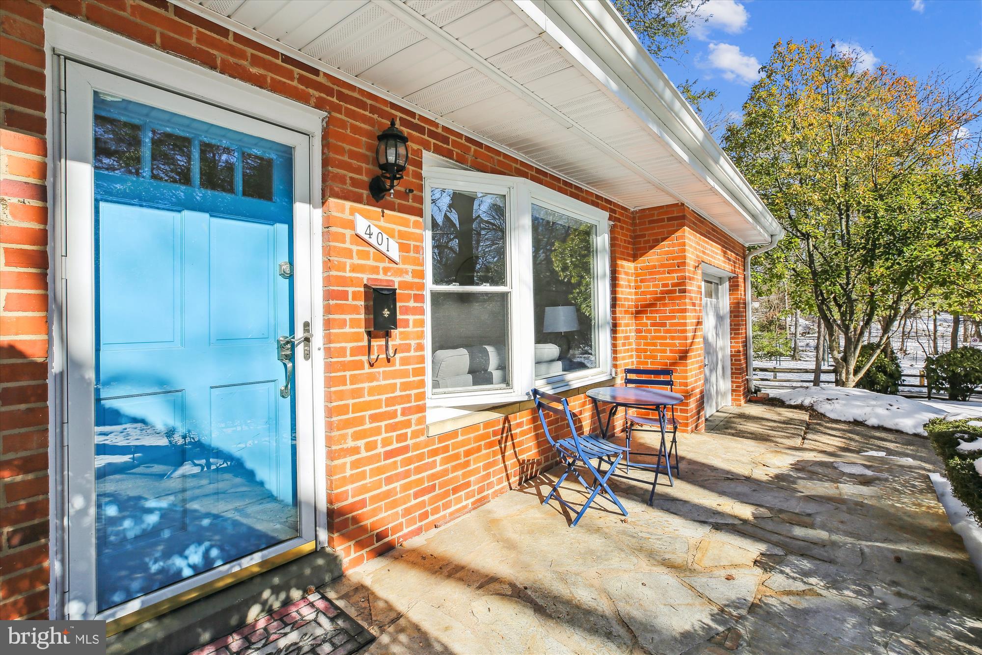 401 Greenbrier Drive Silver Spring, MD 20910 - Photo 6 of 57 a view of a patio with table and chairs and floor to ceiling window and wooden fence
