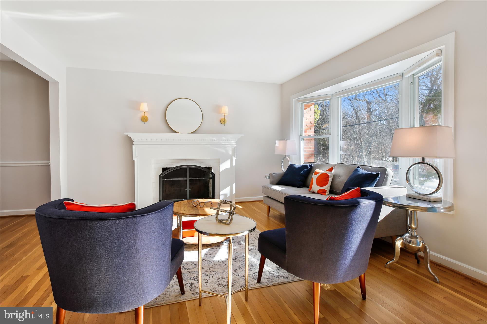 401 Greenbrier Drive Silver Spring, MD 20910 - Photo 10 of 57 a living room with furniture a fireplace and a table