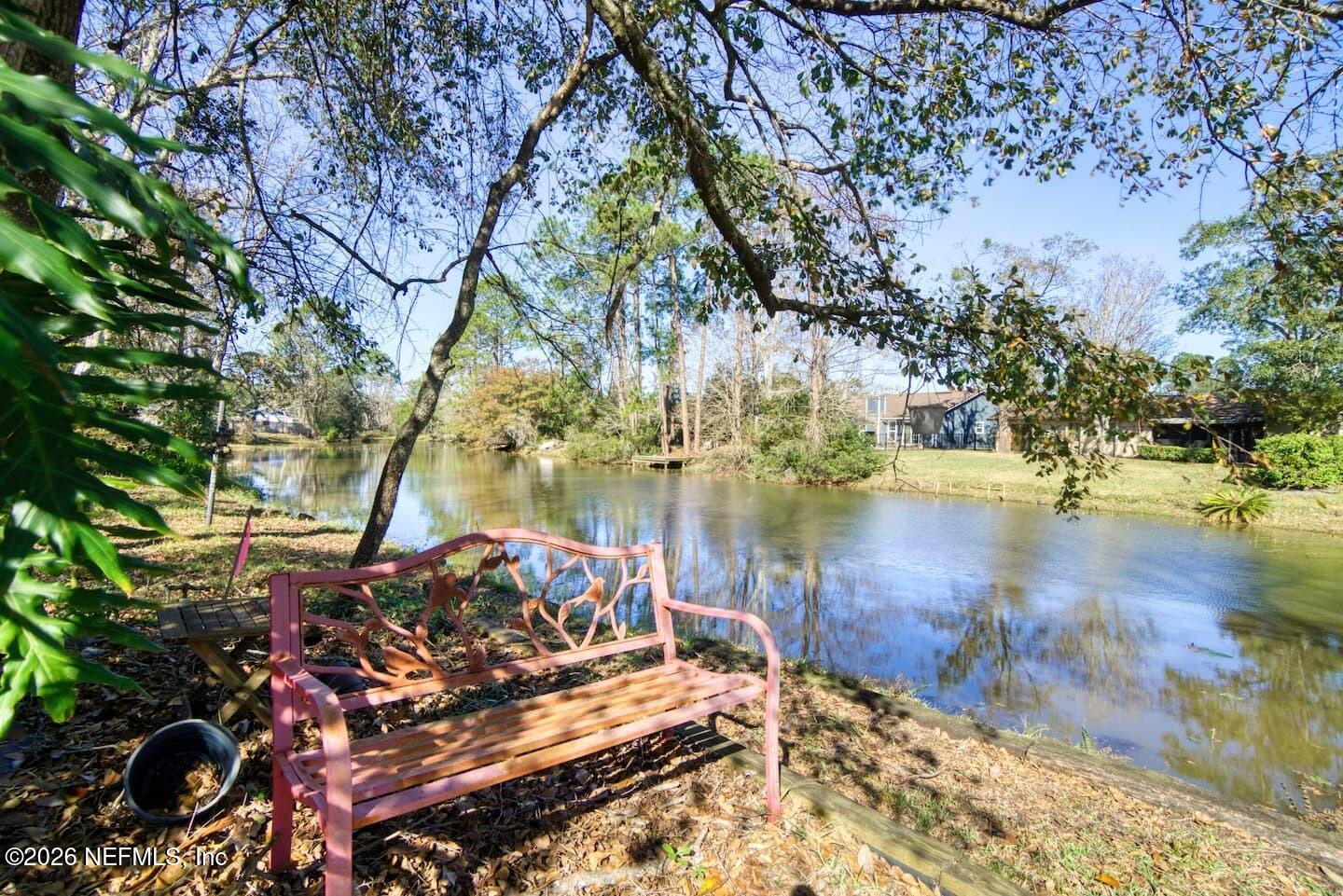 11613 Lake Ride Drive Jacksonville, FL 32223 - Photo 9 of 42 a view of a lake with houses