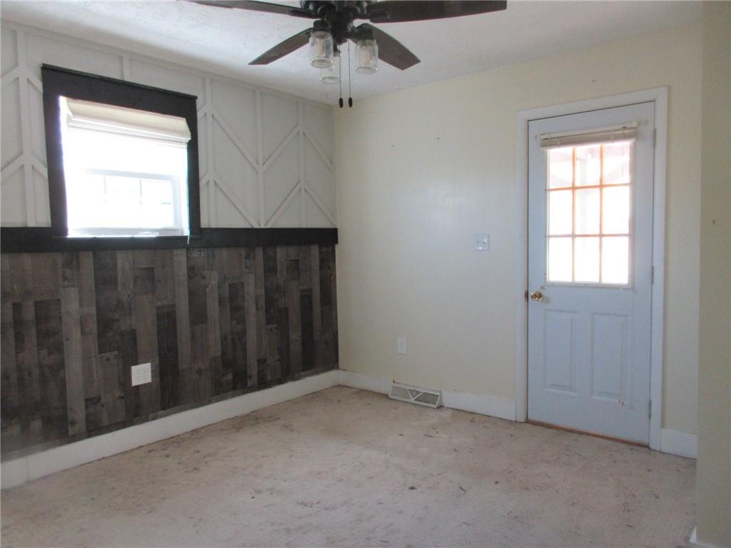 174 Adamson Road Marianna, PA 15345 - Photo 12 of 28 an empty room with a window and ceiling fan