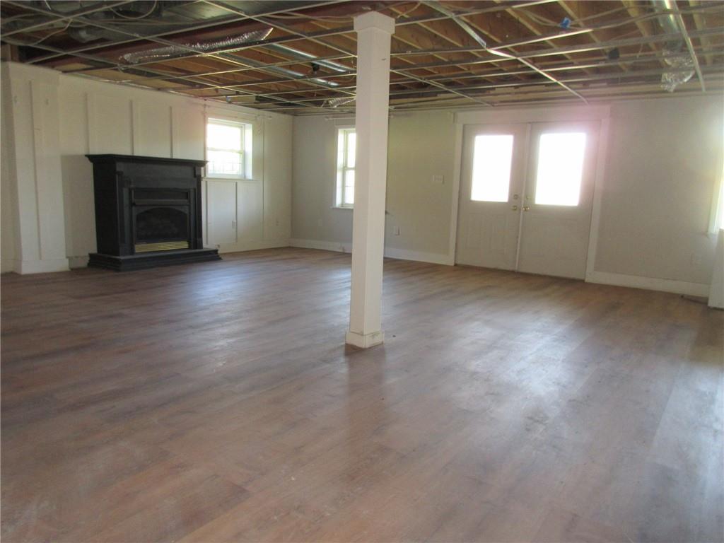 174 Adamson Road Marianna, PA 15345 - Photo 15 of 28 an empty room with wooden floor and windows