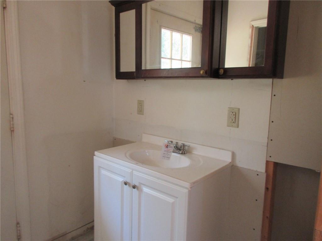 174 Adamson Road Marianna, PA 15345 - Photo 21 of 28 a bathroom with a sink and a mirror