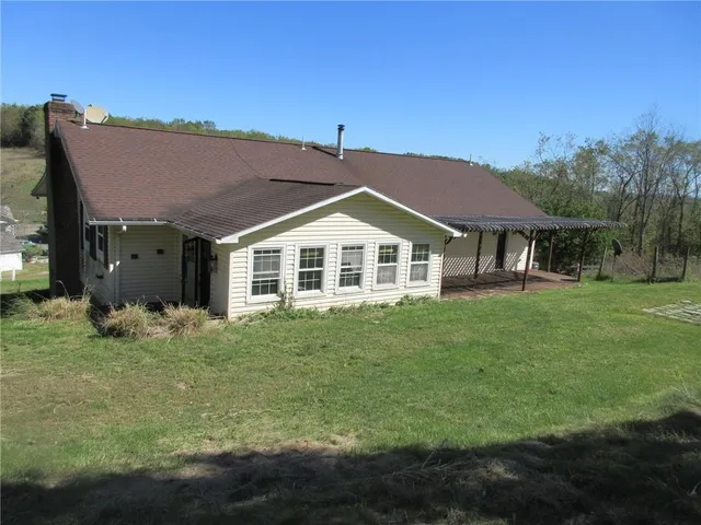 a view of a house with a yard