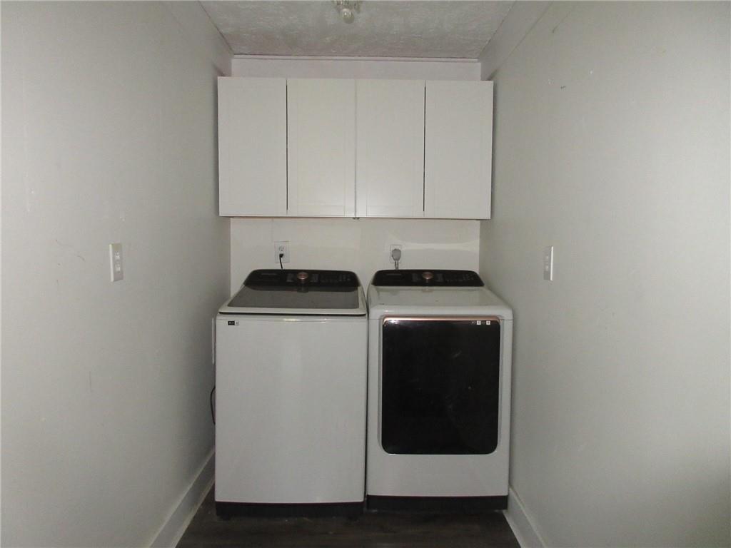 174 Adamson Road Marianna, PA 15345 - Photo 7 of 28 a utility room with wooden floor washer and dryer
