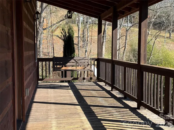 a balcony with wooden floor