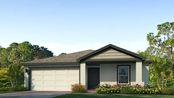 a front view of a house with flowers