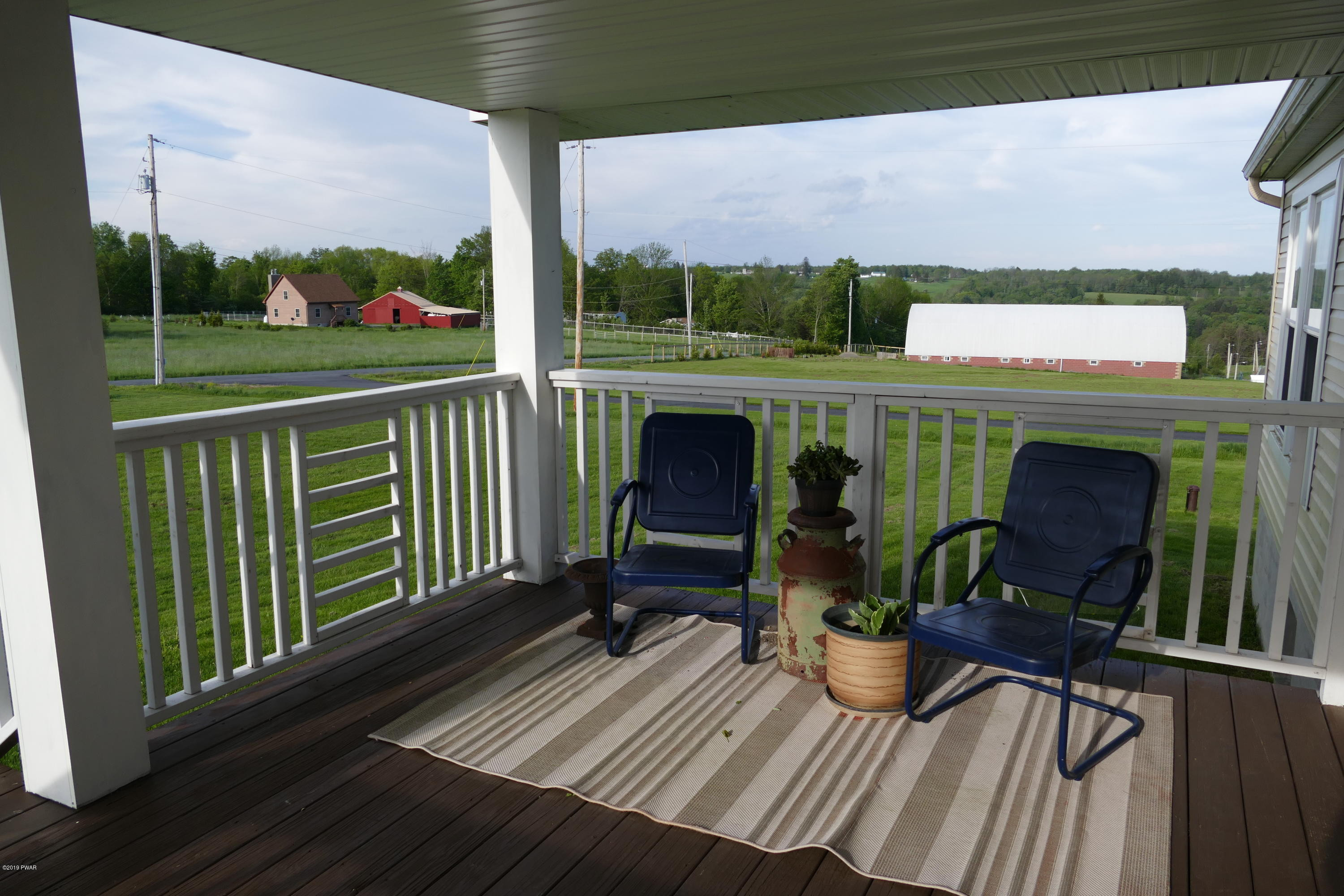 108 Savitz Road Moscow, PA 18444 - Photo 13 of 46 a view of a chairs and table on the wooden deck