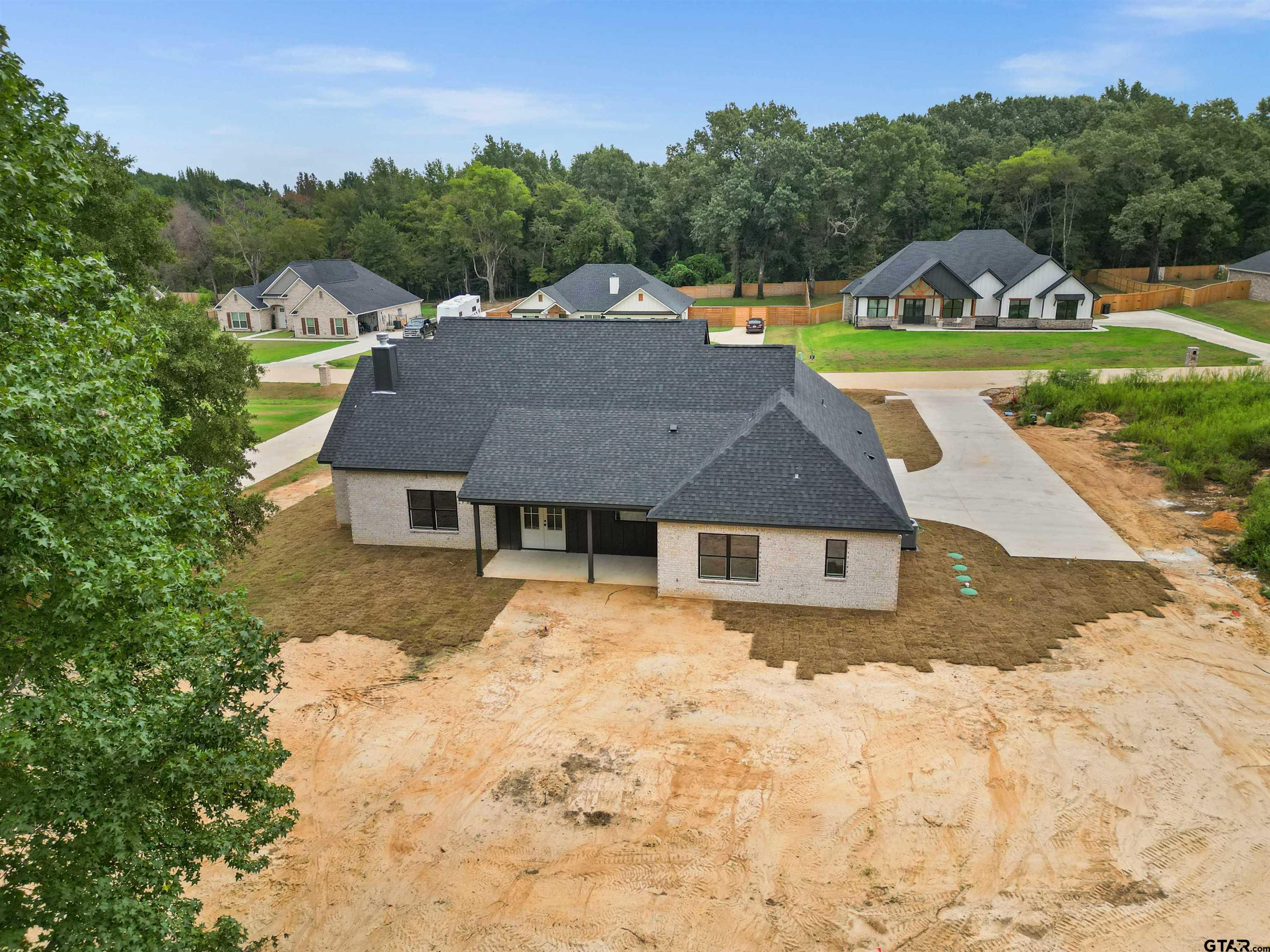 14552 Fallow Lane Tyler, TX 75706 - Photo 15 of 38 a view of a house with a yard and sitting area