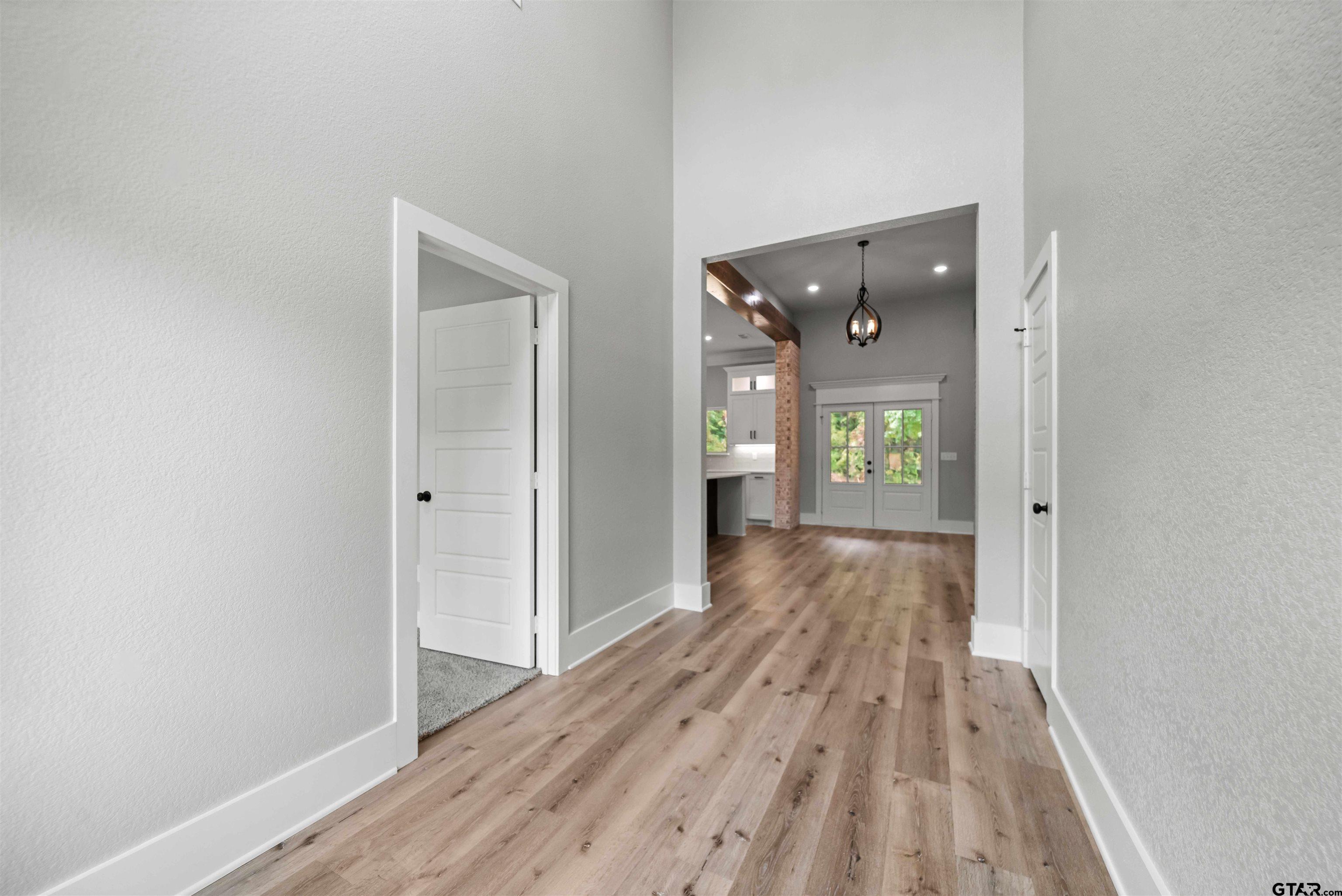 14552 Fallow Lane Tyler, TX 75706 - Photo 17 of 38 a view of a hallway with wooden floor and closet