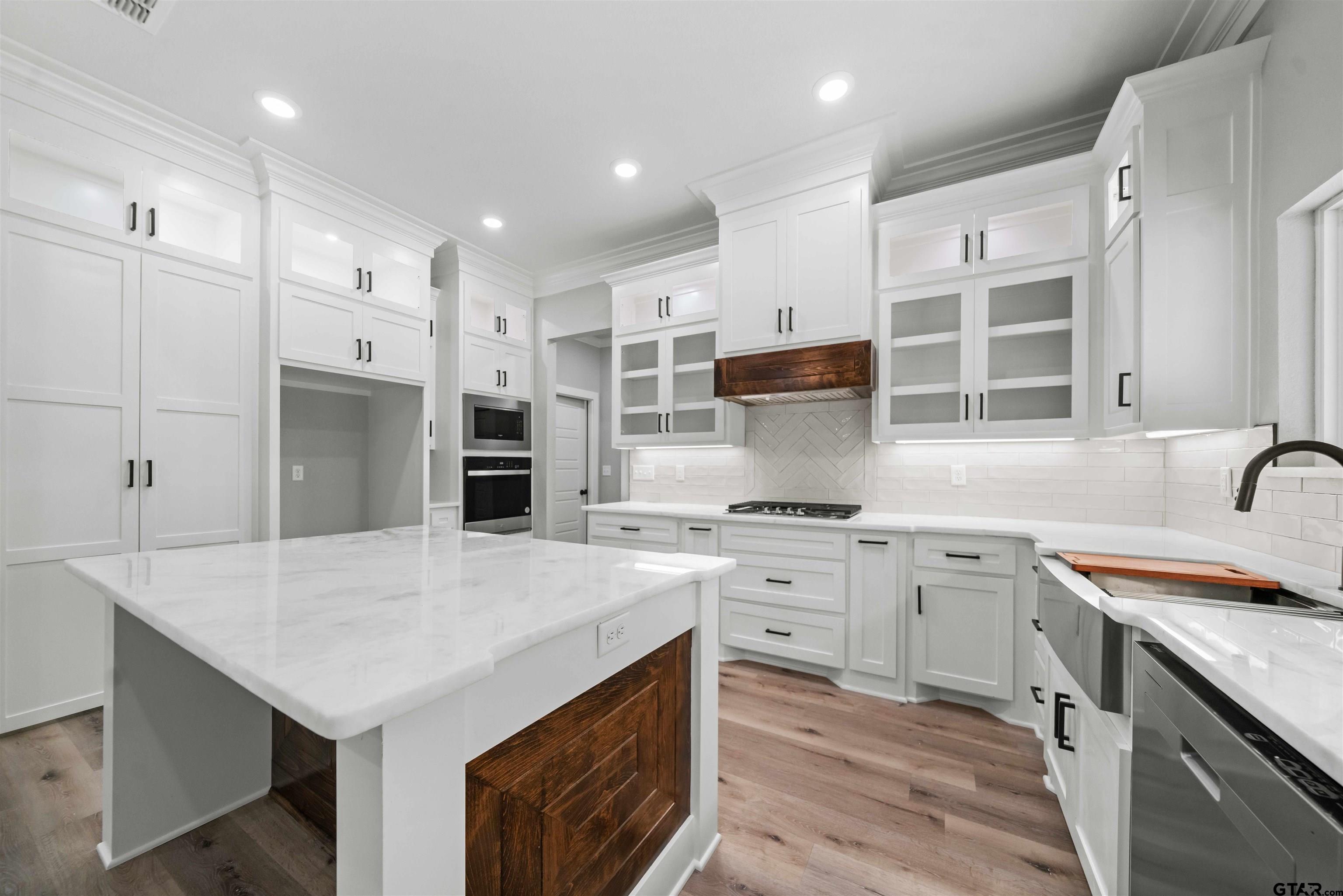 14552 Fallow Lane Tyler, TX 75706 - Photo 21 of 38 a kitchen with stainless steel appliances granite countertop a sink stove and refrigerator
