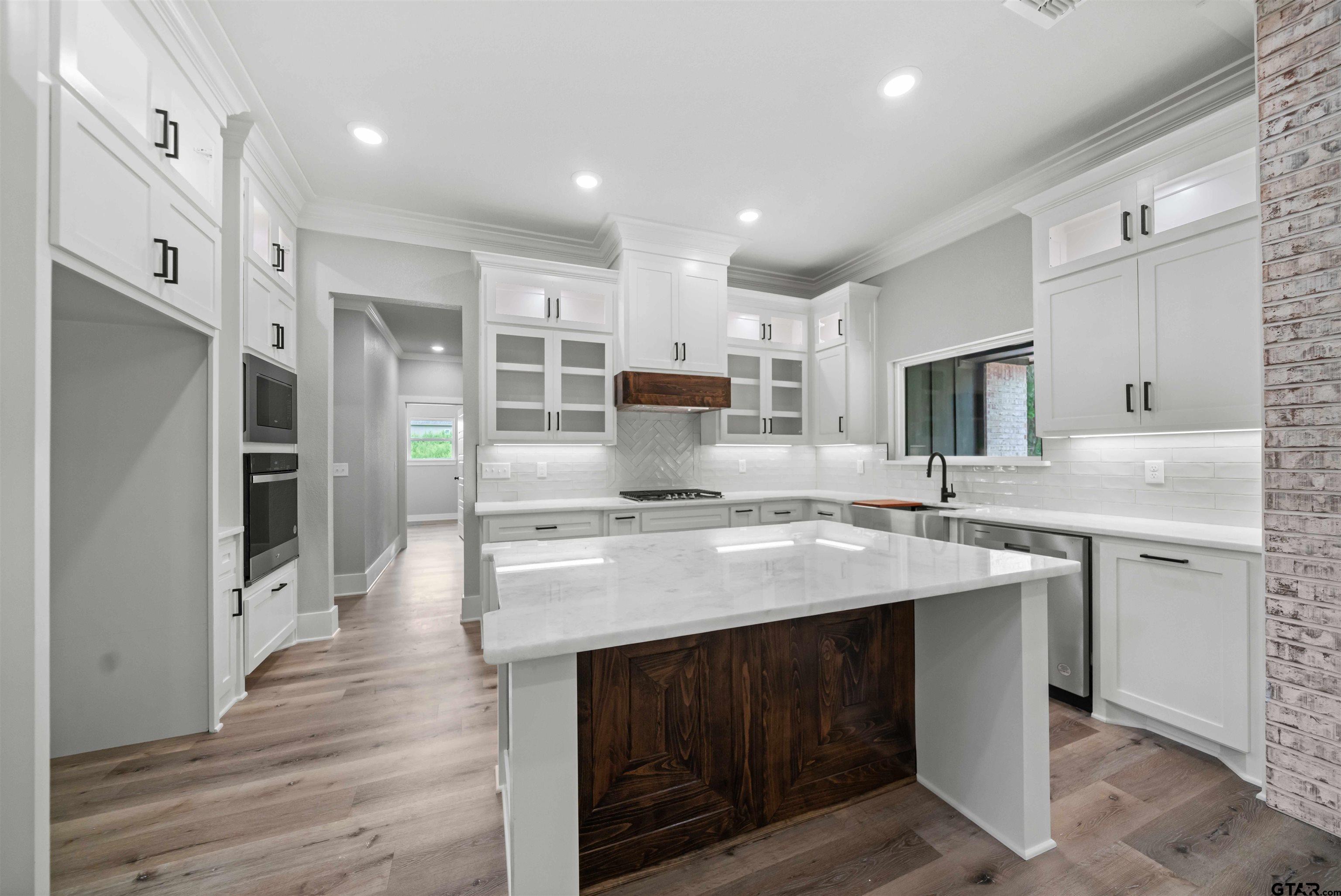 14552 Fallow Lane Tyler, TX 75706 - Photo 23 of 38 a kitchen with stainless steel appliances granite countertop a sink stove and refrigerator