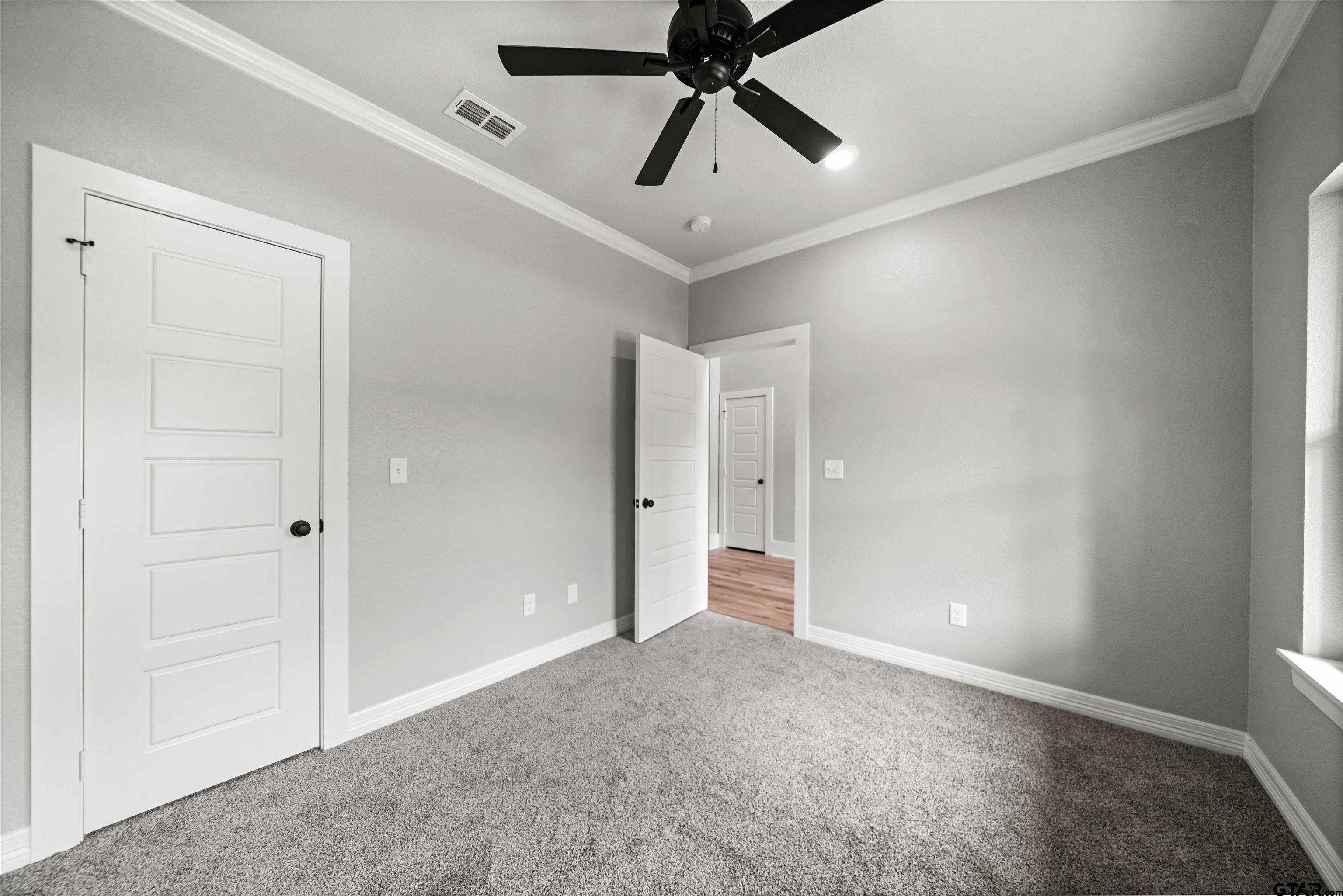 14552 Fallow Lane Tyler, TX 75706 - Photo 30 of 38 a view of an empty room and chandelier fan