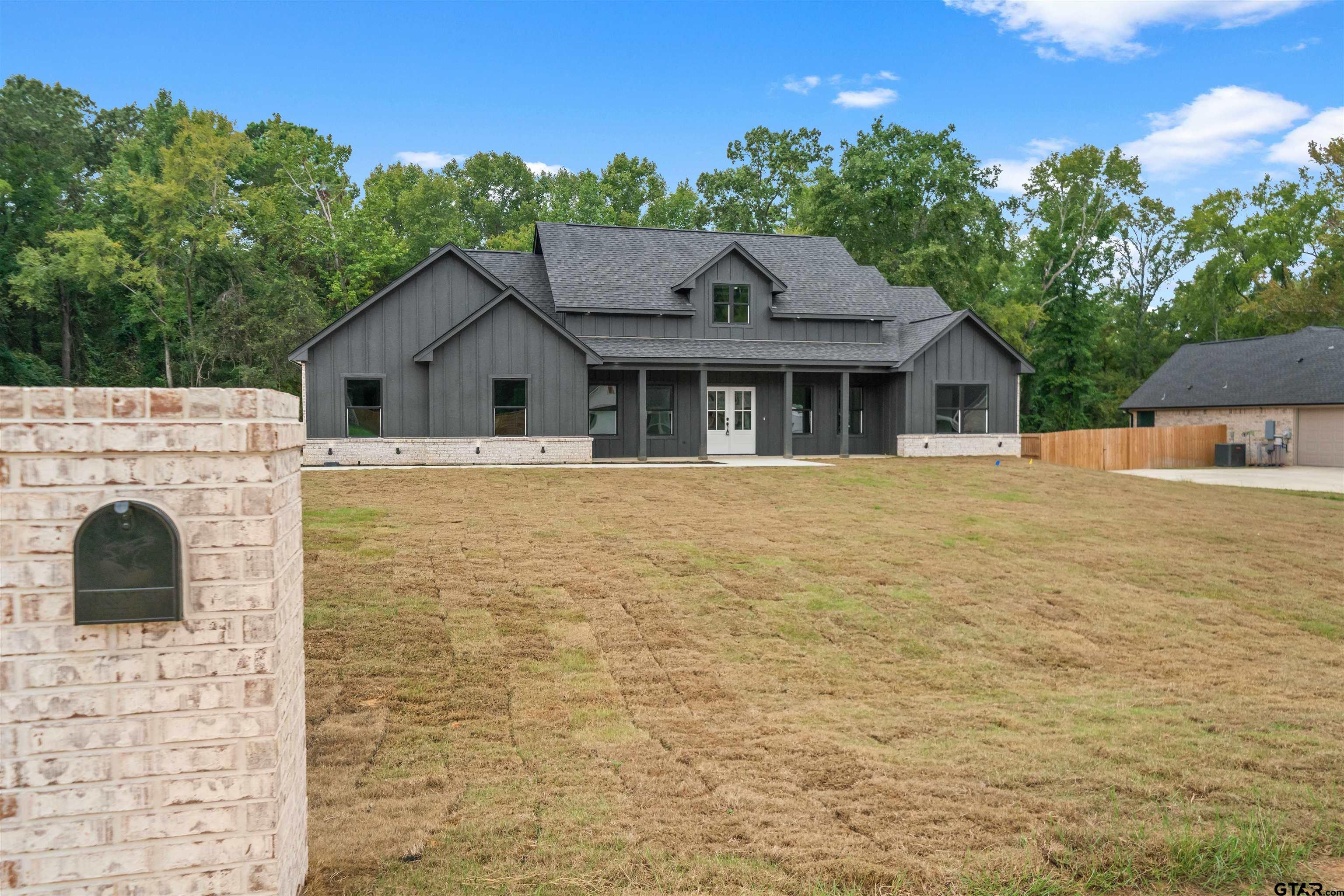 14552 Fallow Lane Tyler, TX 75706 - Photo 3 of 38 a front view of a house with a garden