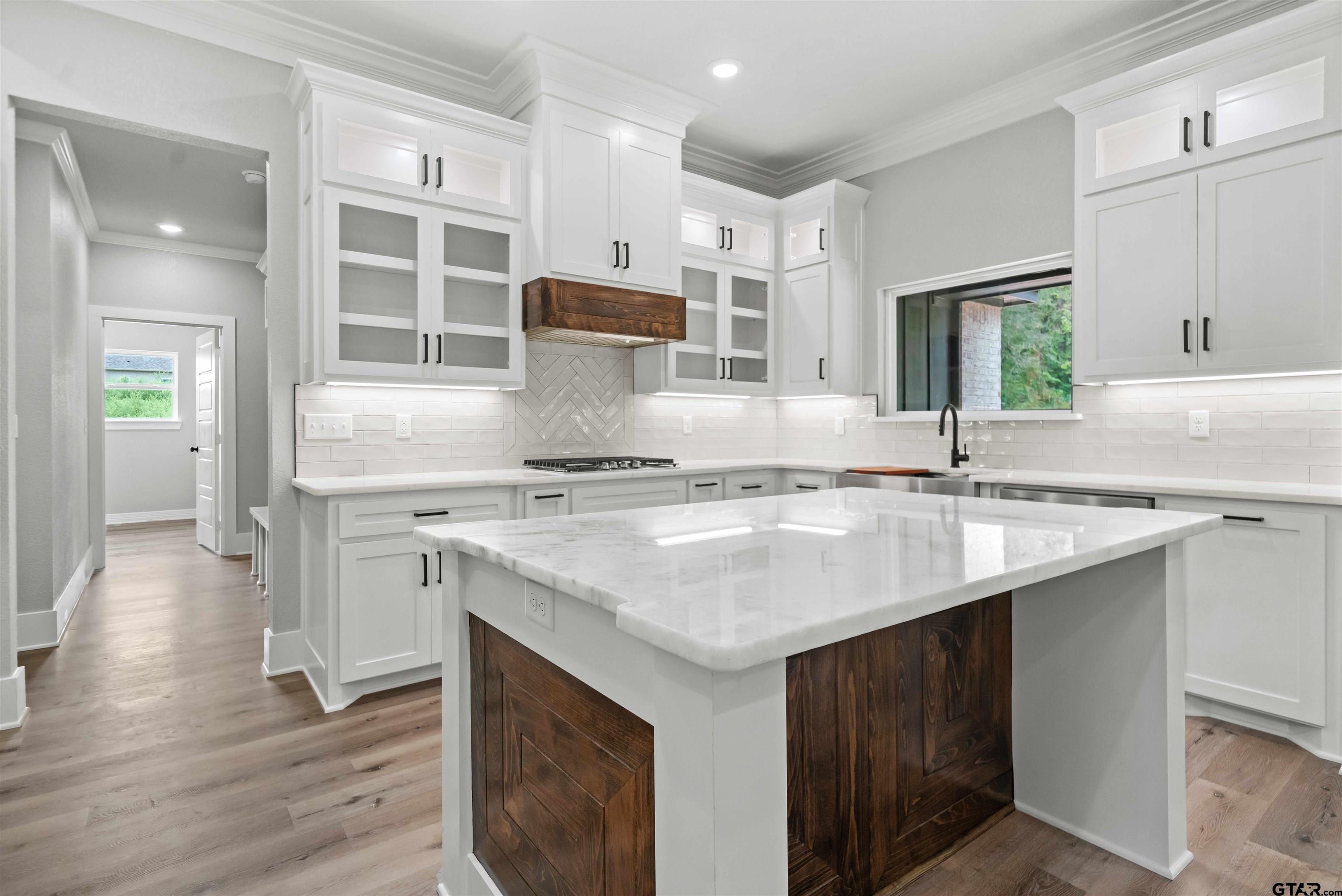 14552 Fallow Lane Tyler, TX 75706 - Photo 32 of 38 a kitchen with stainless steel appliances granite countertop a sink stove and cabinets