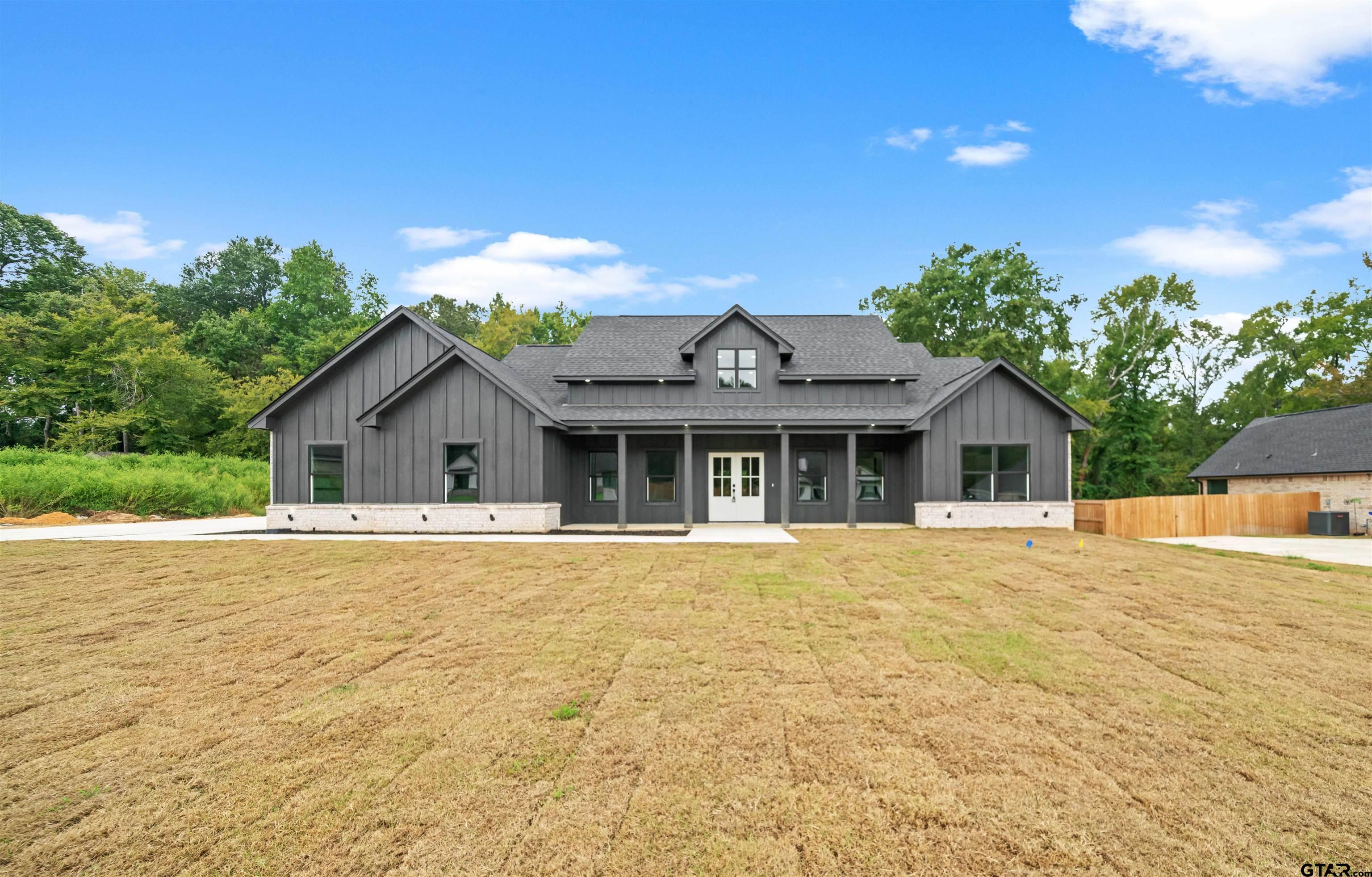 14552 Fallow Lane Tyler, TX 75706 - Photo 36 of 38 a front view of house with yard and trees in the background