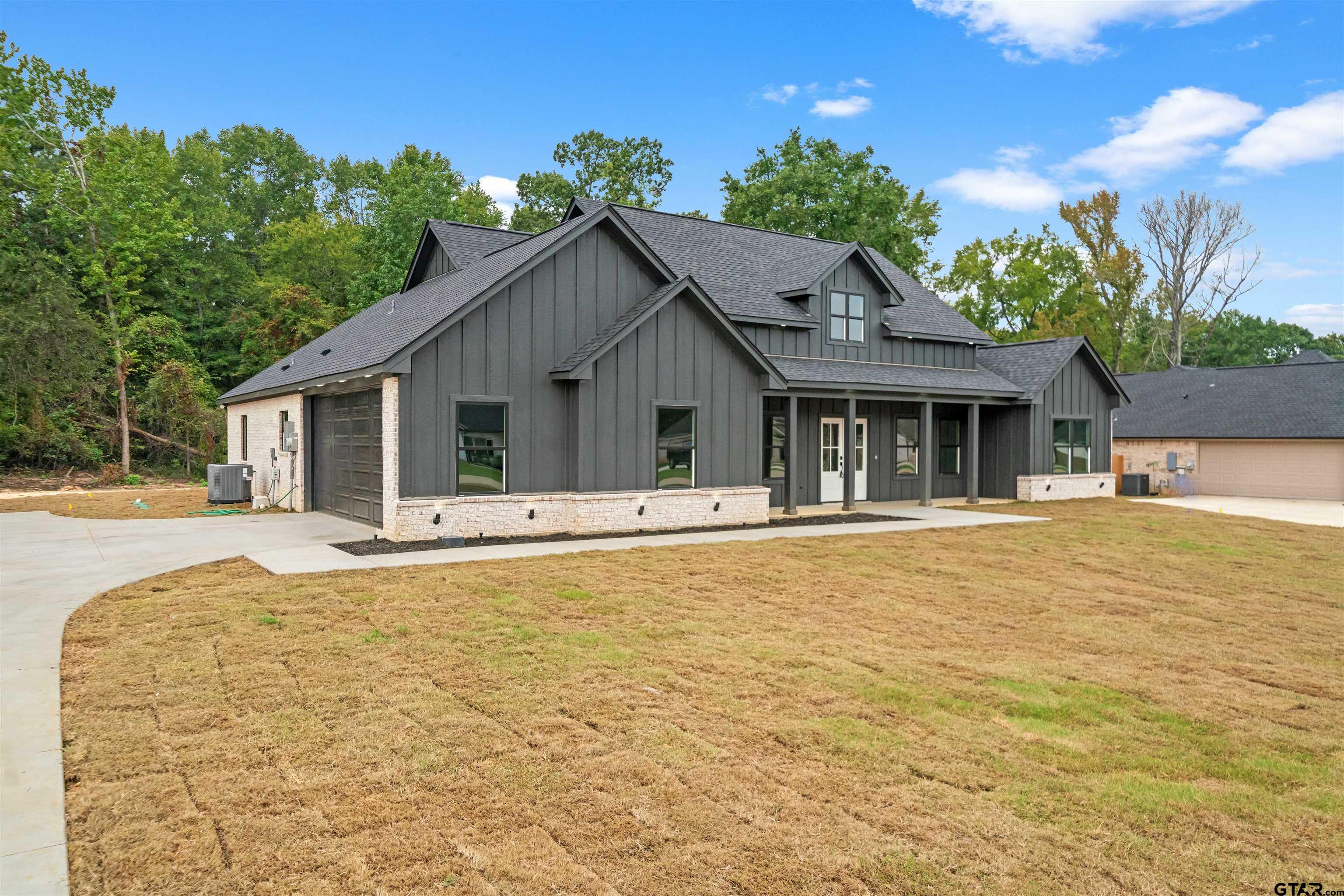 14552 Fallow Lane Tyler, TX 75706 - Photo 37 of 38 a front view of house with yard and trees in the background