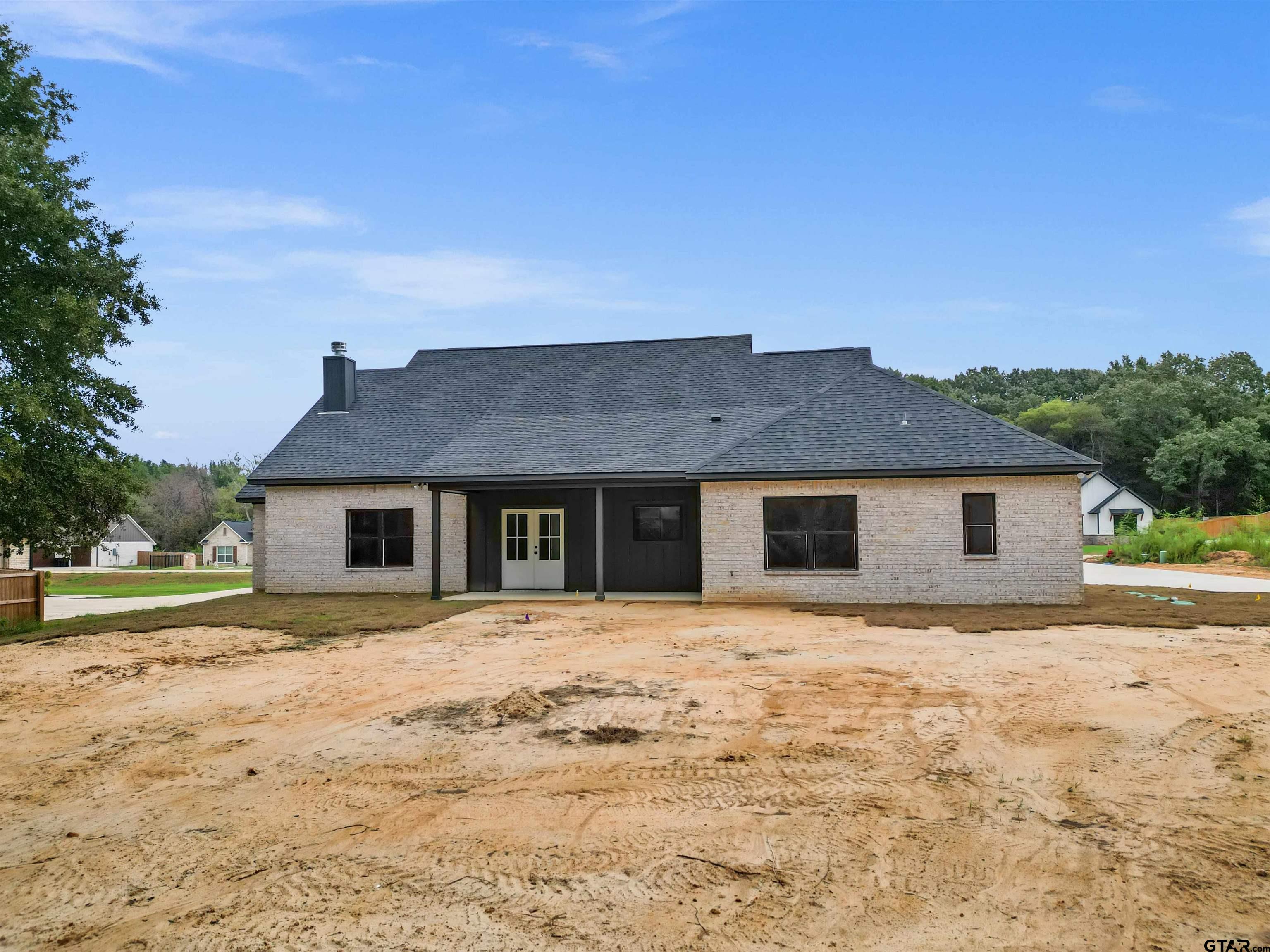 14552 Fallow Lane Tyler, TX 75706 - Photo 38 of 38 a front view of a house with a yard