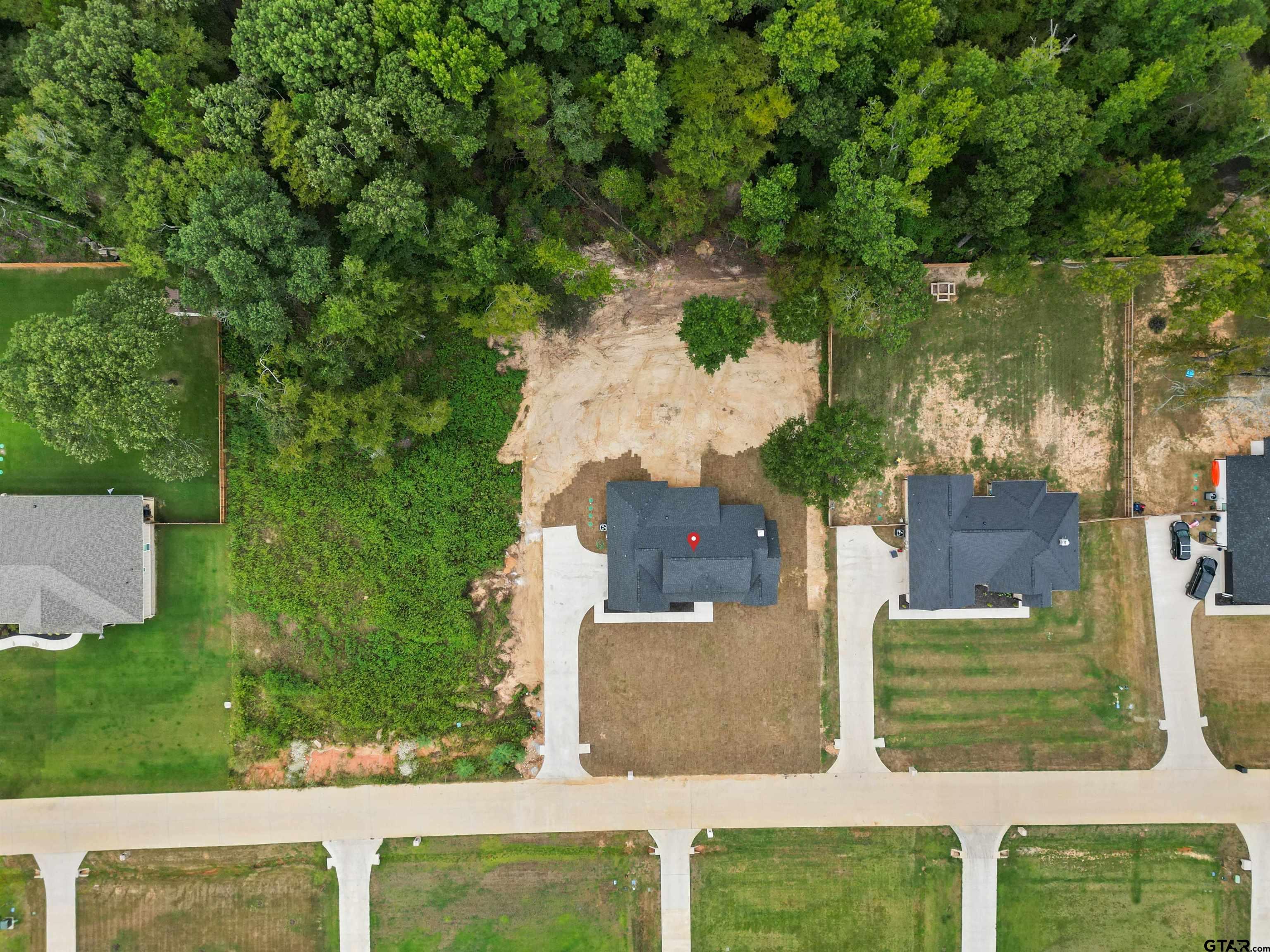 14552 Fallow Lane Tyler, TX 75706 - Photo 6 of 38 an aerial view of residential houses with outdoor space and lake view