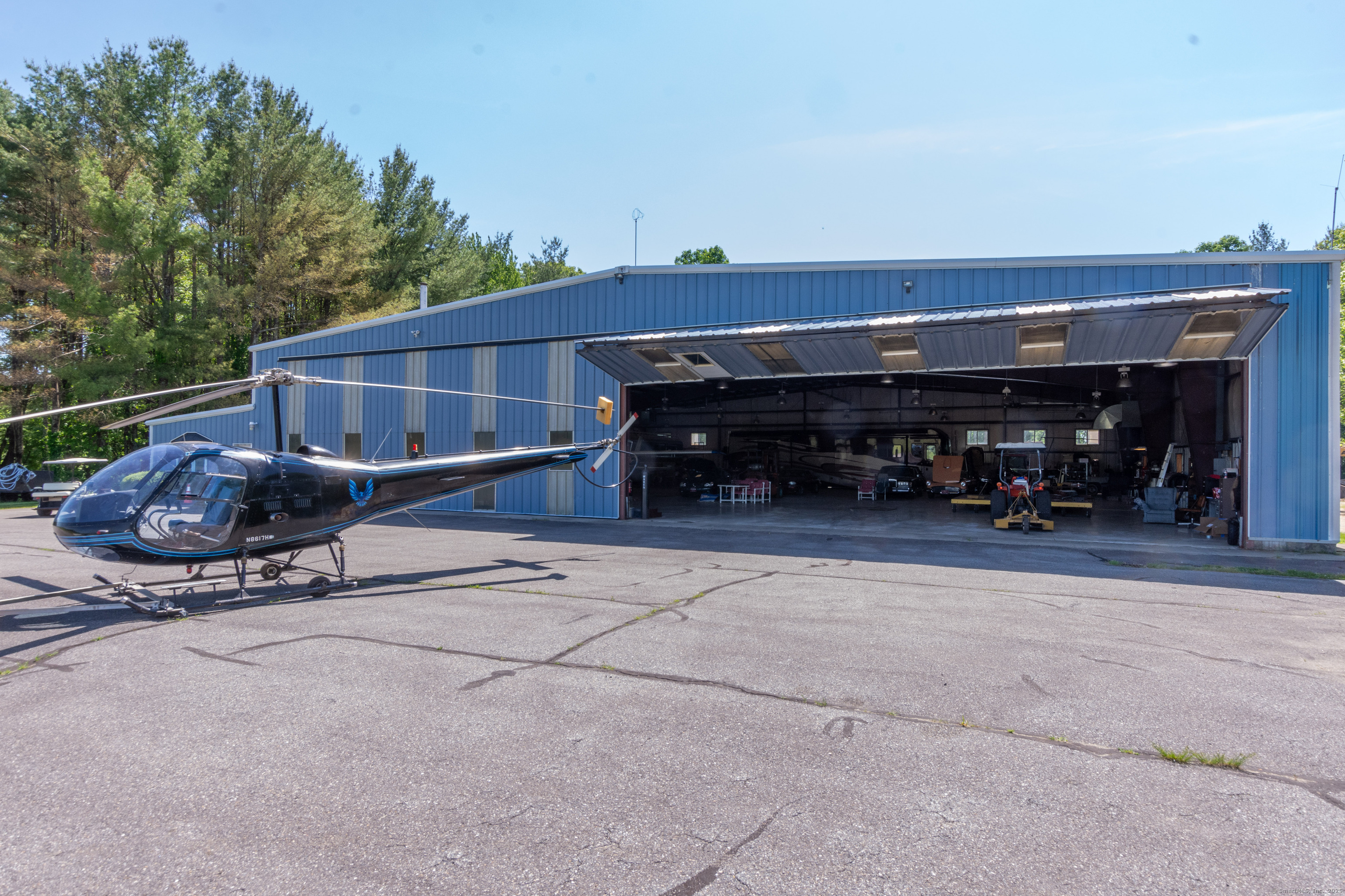 80 Bungay Hill Road Woodstock, CT 06282 - Photo 12 of 39 a living room with furniture a flat screen tv and a fireplace