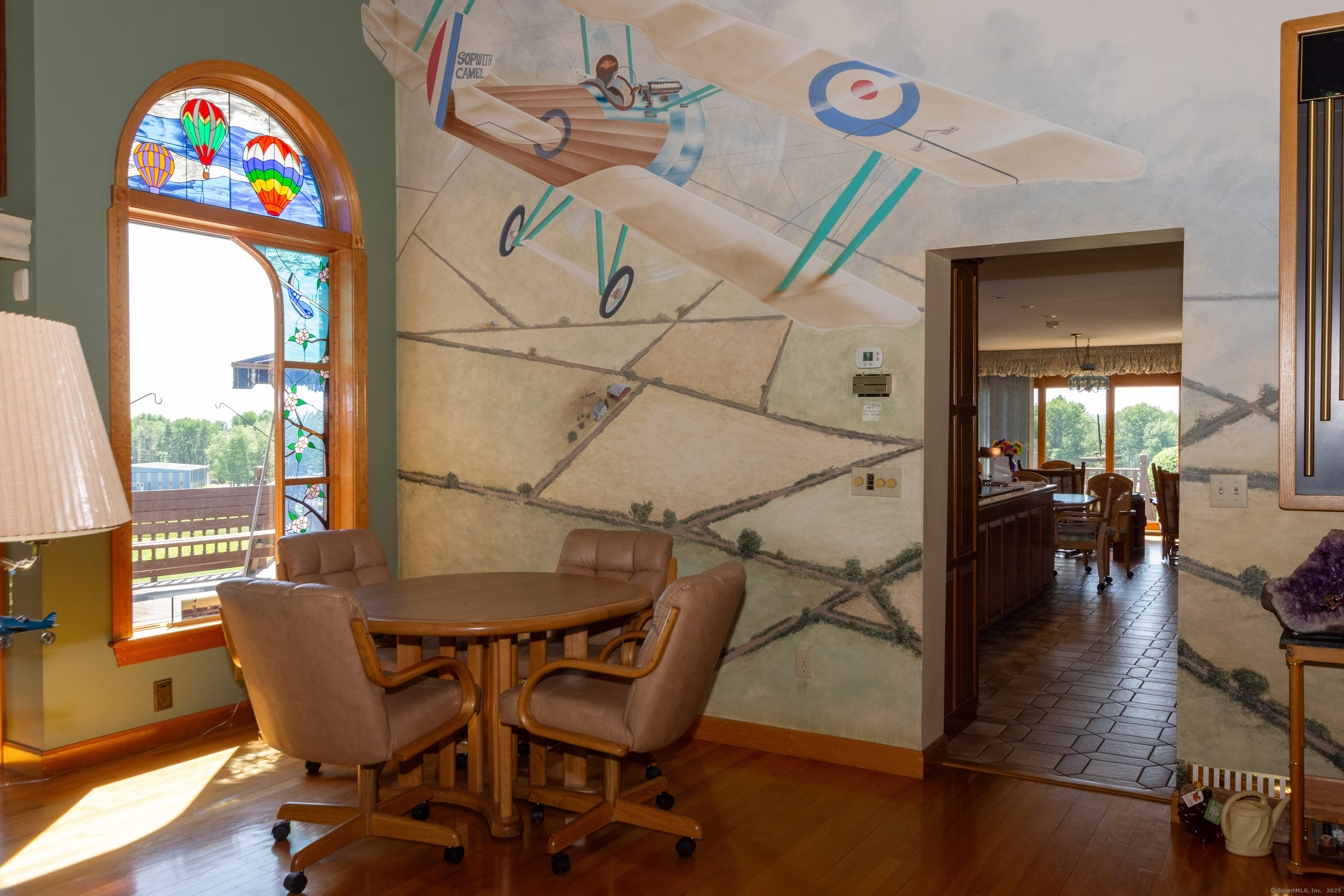80 Bungay Hill Road Woodstock, CT 06282 - Photo 23 of 39 a view of a dining room with furniture and a window