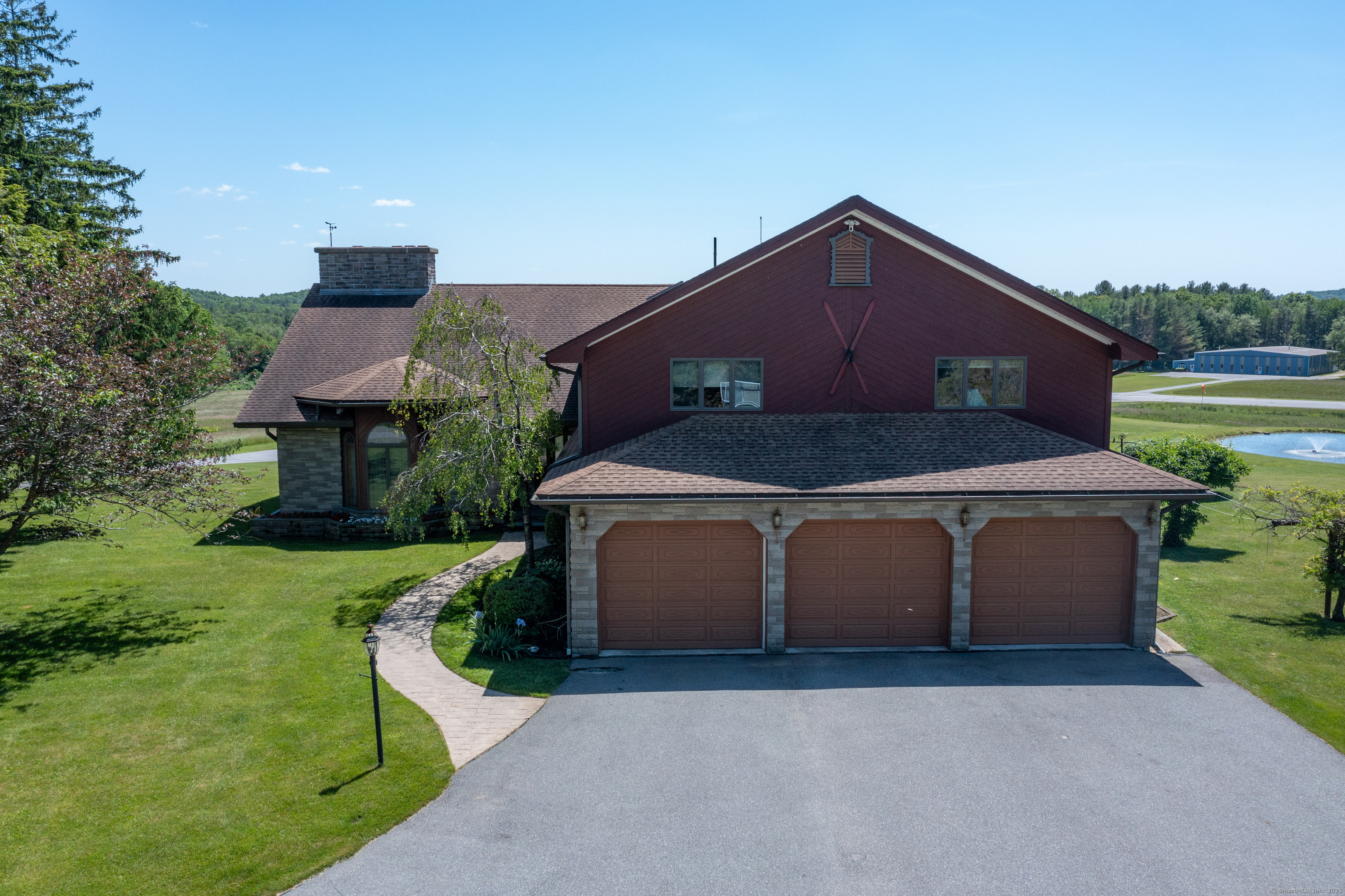 80 Bungay Hill Road Woodstock, CT 06282 - Photo 31 of 39 a front view of a house with a yard and garage