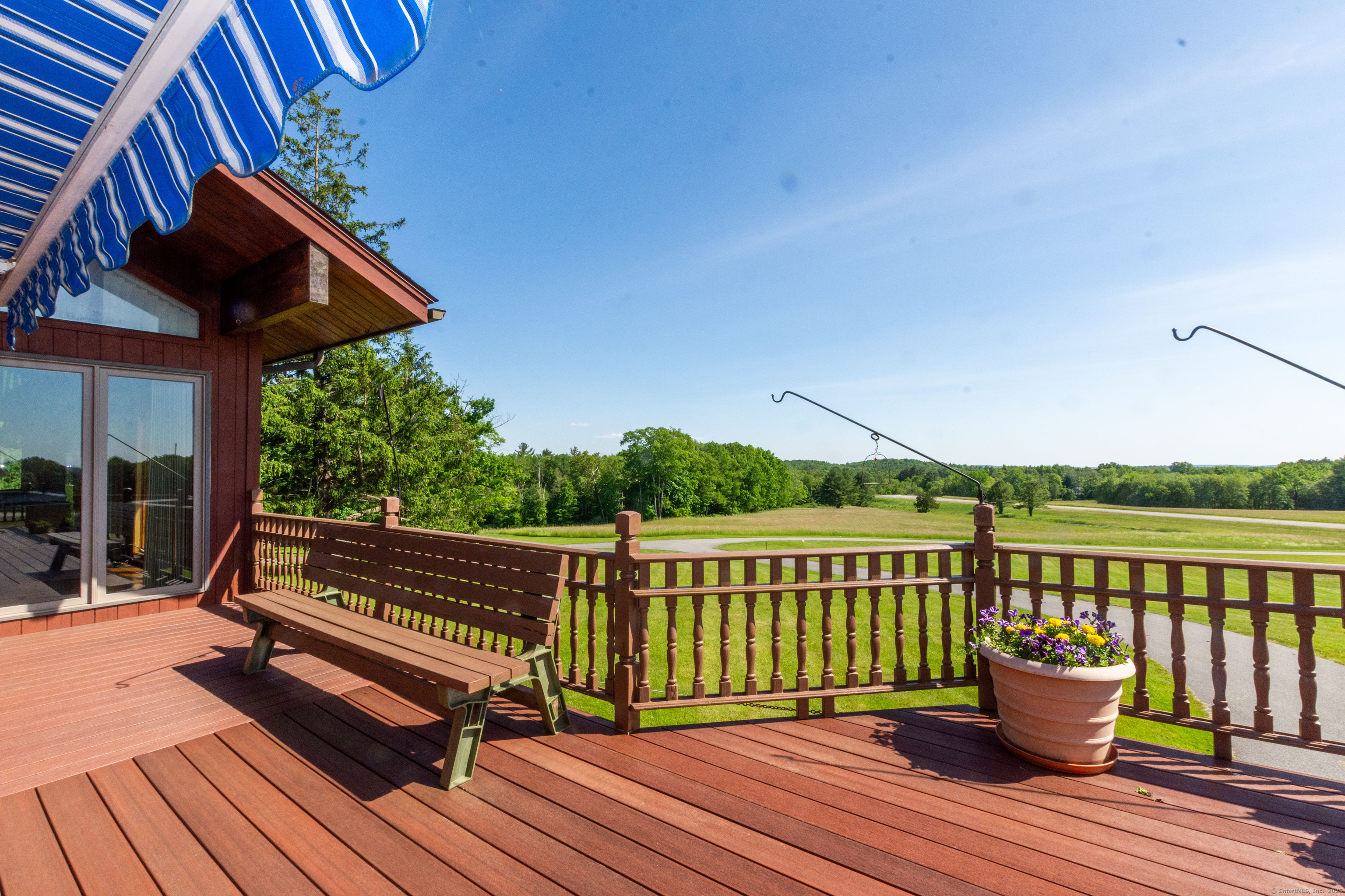 80 Bungay Hill Road Woodstock, CT 06282 - Photo 34 of 39 a view of a roof deck with wooden floor and fence