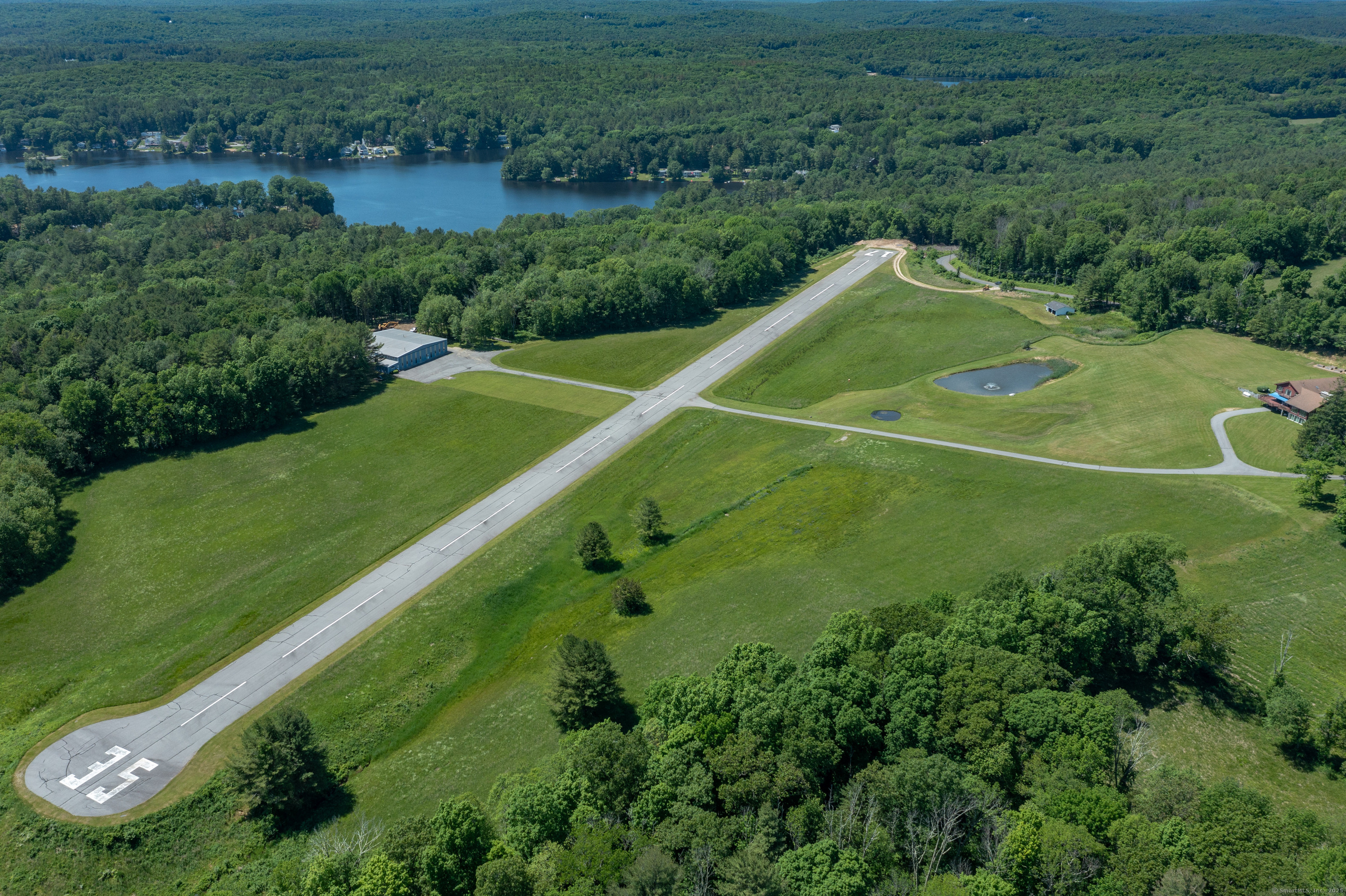 80 Bungay Hill Road Woodstock, CT 06282 - Photo 5 of 39 an aerial view of a football ground