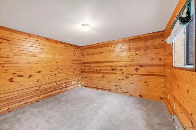 a bedroom with a bed and a cabinets