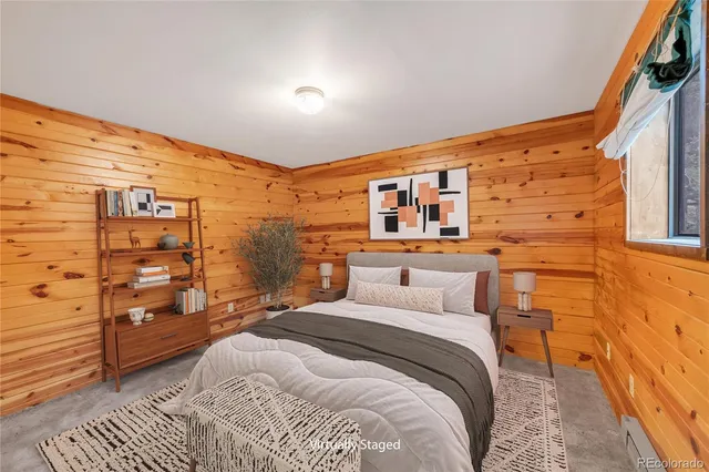 a view of room with walk in closet and bedroom