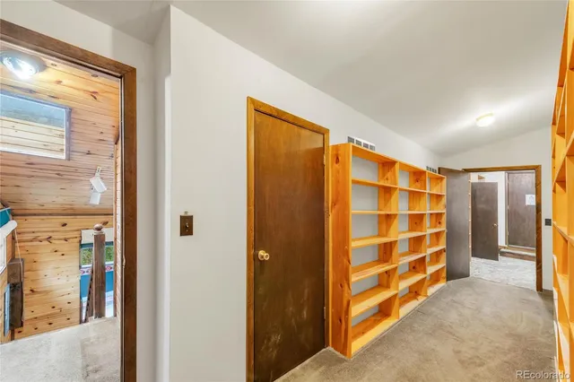 a bathroom with a sink toilet and mirror