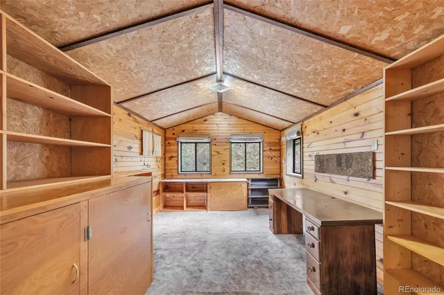 a picture of a bench in front of a wall