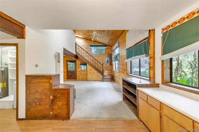 a view of an entryway with kitchen