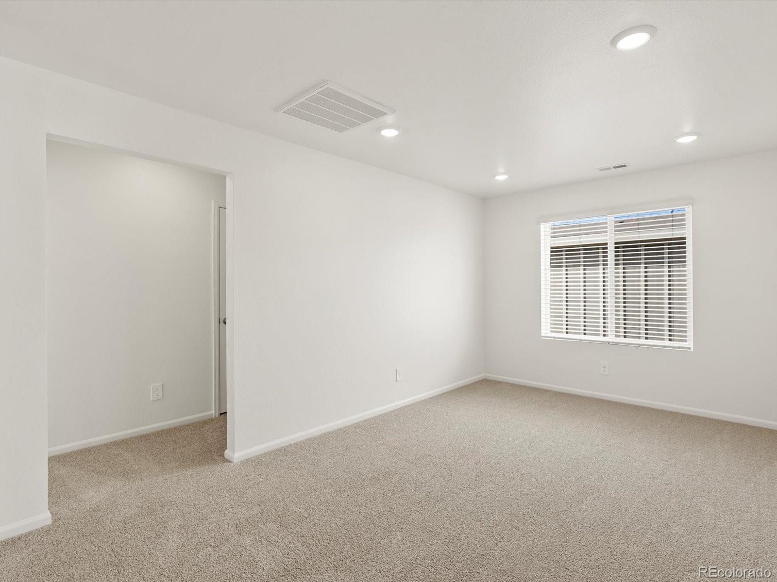 7304 West 27th St Road Greeley, CO 80634 - Photo 17 of 30 a view of an empty room with a window