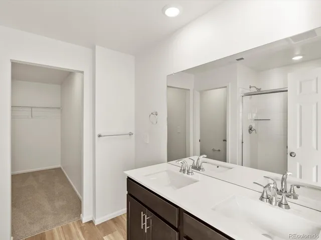 a bathroom with a shower and a tub