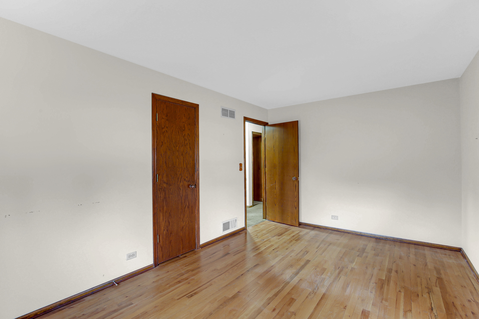 3723 Ronald Road Crete, IL 60417 - Photo 20 of 25 a view of an empty room with wooden floor and closet