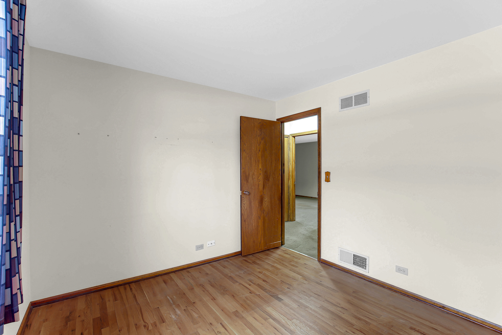 3723 Ronald Road Crete, IL 60417 - Photo 22 of 25 a view of an empty room with wooden floor and closet