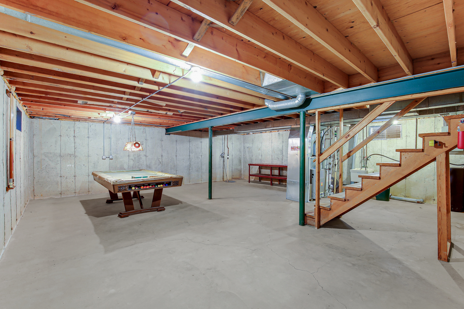 3723 Ronald Road Crete, IL 60417 - Photo 24 of 25 a view of a big room with wooden walls and stairs
