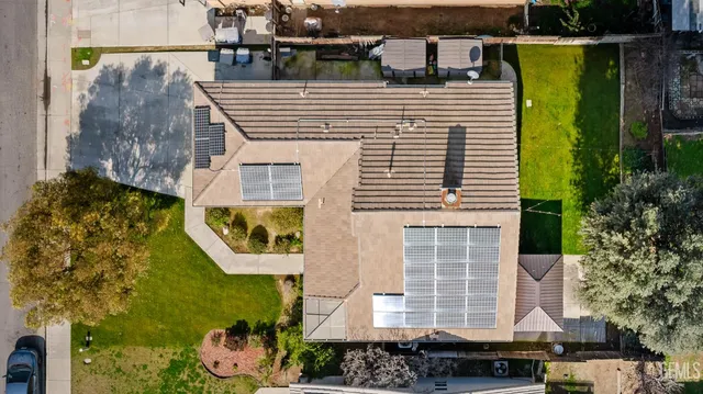a spacious bedroom with a bed and a chandelier