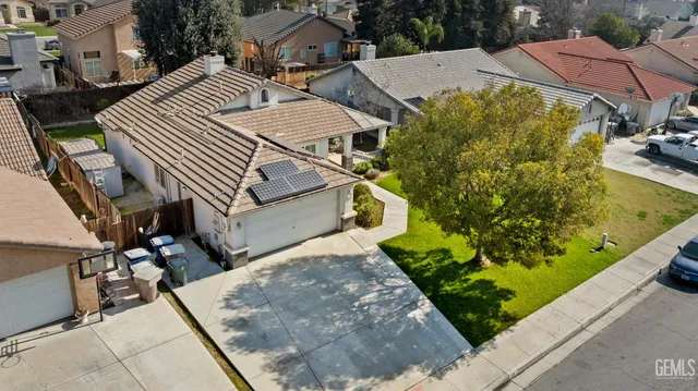a bathroom with a sink a toilet and shower curtain
