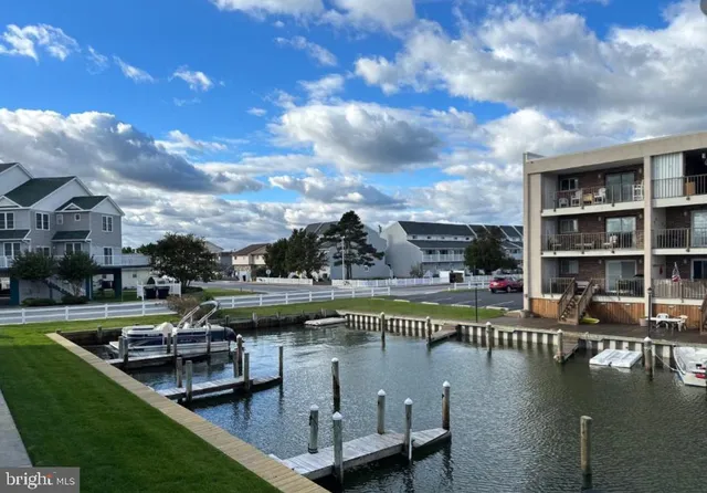 a view of a lake with a house swimming pool and outdoor space