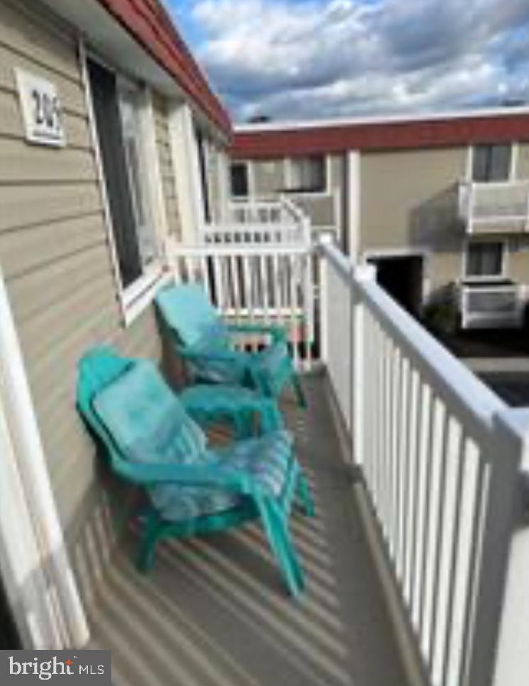 8908 Rusty Anchor Road, Unit 20501 Ocean City, MD 21842 - Photo 14 of 15 a view of balcony with wooden floor