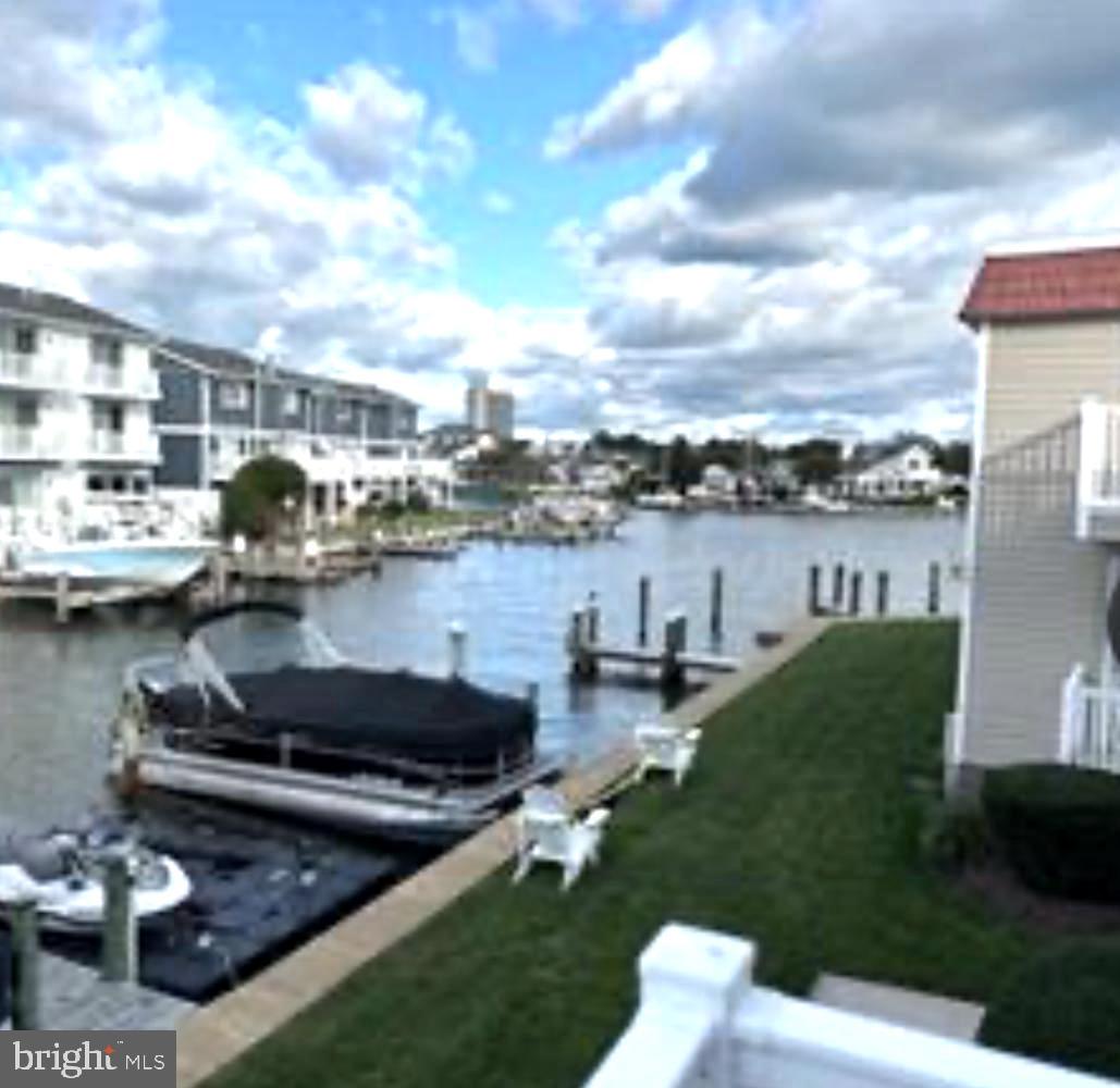 8908 Rusty Anchor Road, Unit 20501 Ocean City, MD 21842 - Photo 2 of 15 a view of a lake with houses