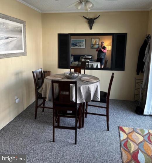 8908 Rusty Anchor Road, Unit 20501 Ocean City, MD 21842 - Photo 6 of 15 a view of a dining room with furniture