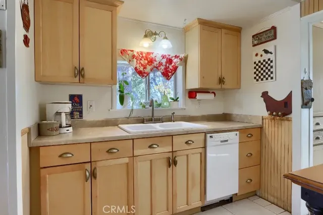 a kitchen with cabinets and window